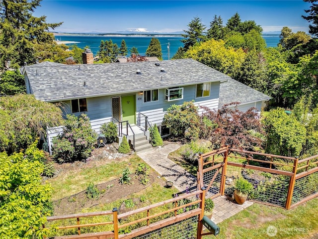 434 T St, Port Townsend, WA 98368 - single story home featuring a water view, a shingled roof, and a chimney