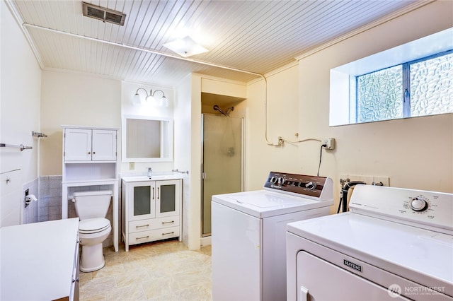 434 T St, Port Townsend, WA 98368 - washroom featuring washer and clothes dryer and wooden ceiling