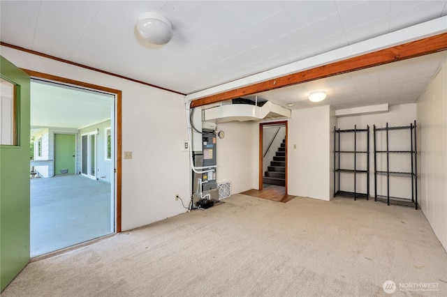 434 T St, Port Townsend, WA 98368 - below grade area featuring carpet floors, heating unit, and stairway