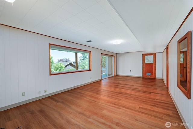 434 T St, Port Townsend, WA 98368 - unfurnished room with light wood-style floors and wood walls