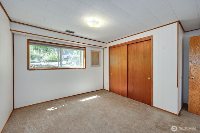 434 T St, Port Townsend, WA 98368 - unfurnished bedroom featuring carpet, crown molding, a closet, and baseboards