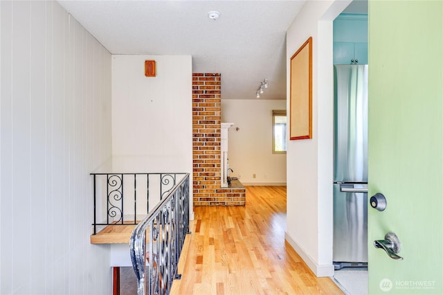 434 T St, Port Townsend, WA 98368 - hall featuring light wood-style floors, an upstairs landing, and baseboards