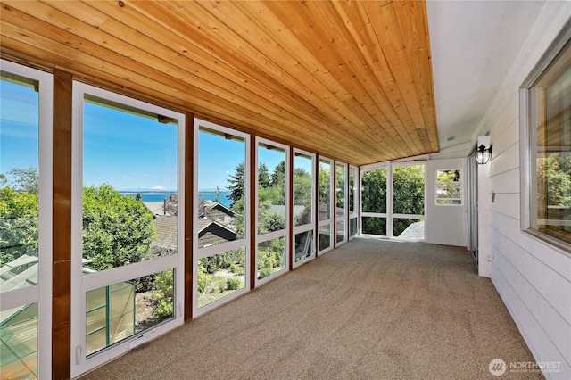 434 T St, Port Townsend, WA 98368 - unfurnished sunroom featuring a water view, wooden ceiling, and carpet flooring
