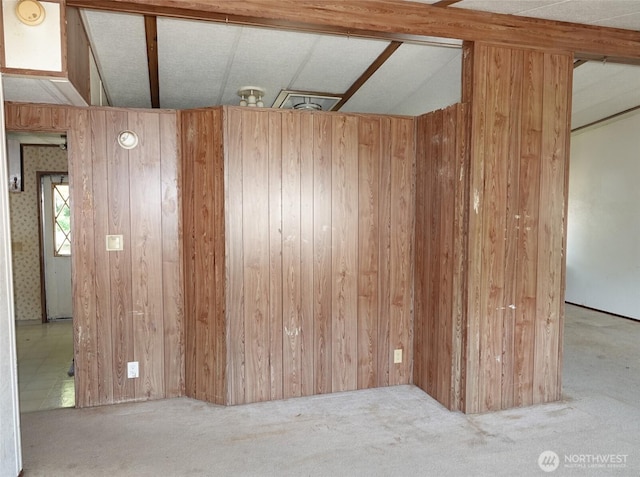 676 Copalis Ave NE, Ocean Shores, WA 98569 - carpeted empty room featuring wood walls and a smoke detector
