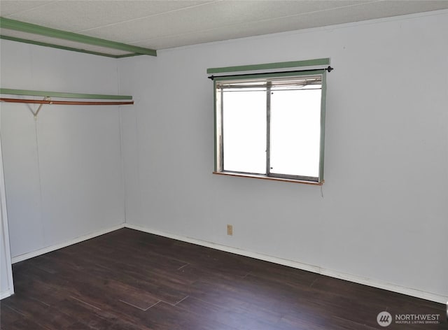 676 Copalis Ave NE, Ocean Shores, WA 98569 - unfurnished room with wood finished floors and baseboards