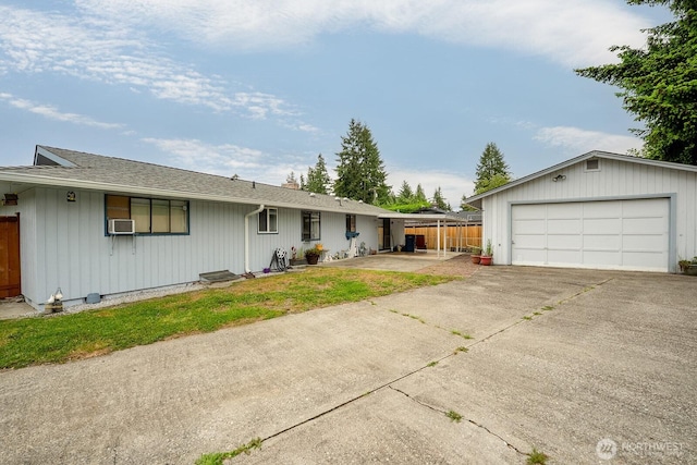 10930 38th Dr SE, Everett, WA 98208 - view of front of house with a detached garage, roof with shingles, and cooling unit