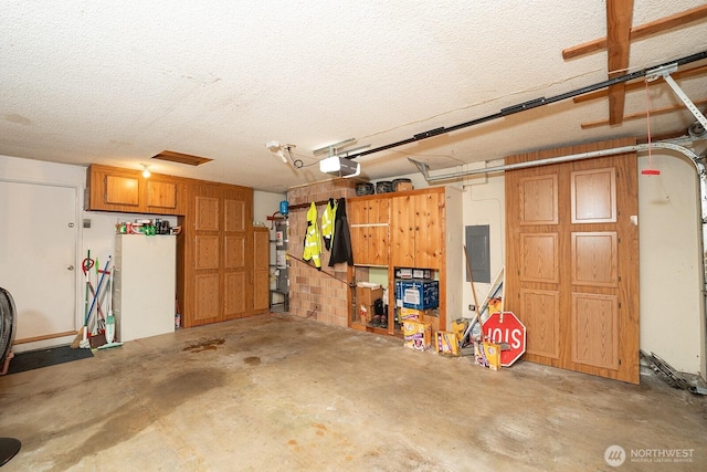 10930 38th Dr SE, Everett, WA 98208 - garage with a garage door opener, electric panel, and strapped water heater
