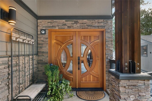 76 Thompson Point Rd, Port Angeles, WA 98363 - doorway to property featuring stone siding