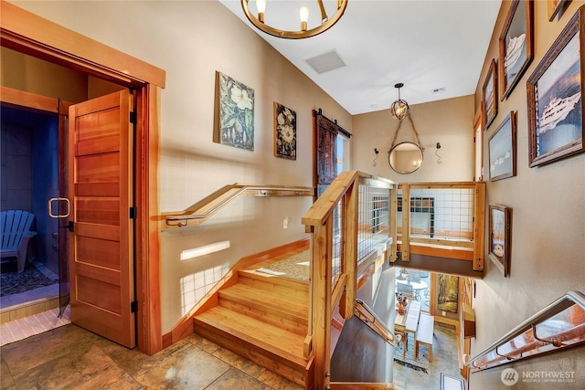 76 Thompson Point Rd, Port Angeles, WA 98363 - stairs with baseboards and a chandelier