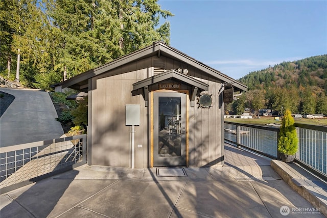 76 Thompson Point Rd, Port Angeles, WA 98363 - view of outdoor structure featuring a water view and a forest view