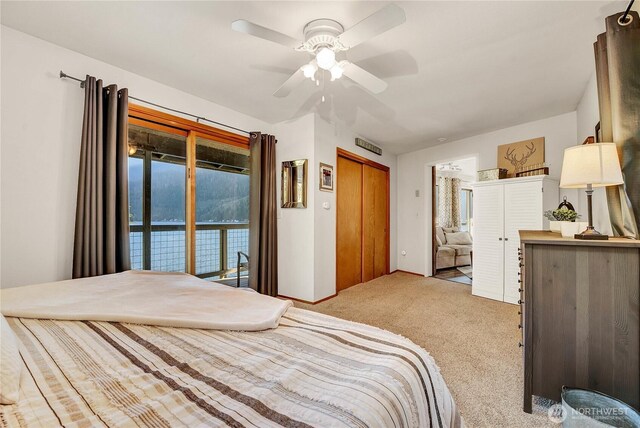 76 Thompson Point Rd, Port Angeles, WA 98363 - bedroom featuring light carpet, ceiling fan, and access to exterior