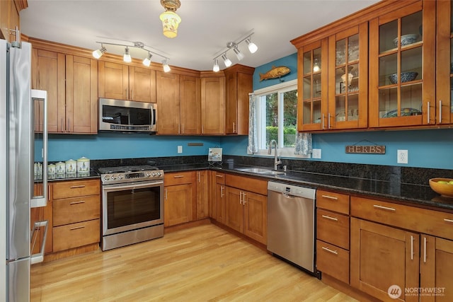 23619 74th Ave W, Edmonds, WA 98026 - kitchen featuring stainless steel appliances, brown cabinetry, and a sink