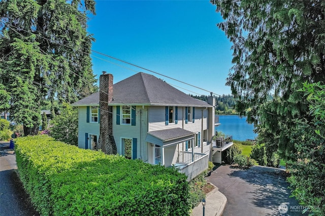 23619 74th Ave W, Edmonds, WA 98026 - view of property exterior with a chimney and roof with shingles
