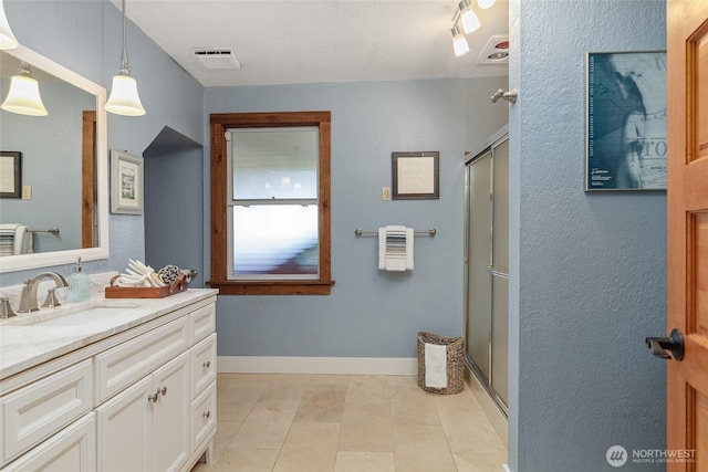 23619 74th Ave W, Edmonds, WA 98026 - bathroom with vanity, a stall shower, and baseboards