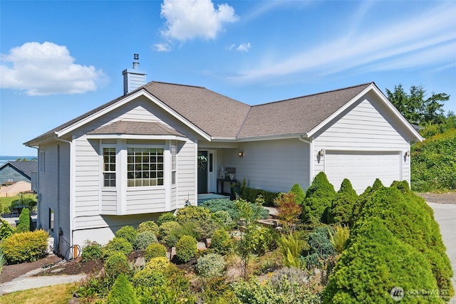 37401 Olympic View Rd NE, Hansville, WA 98340 - single story home with a garage, a chimney, driveway, and a shingled roof