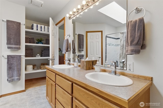 37401 Olympic View Rd NE, Hansville, WA 98340 - full bath with a skylight, double vanity, and a shower with curtain