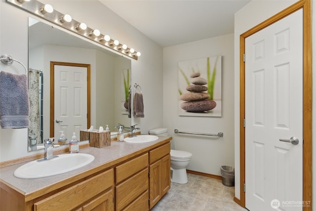 37401 Olympic View Rd NE, Hansville, WA 98340 - bathroom with double vanity and toilet