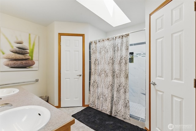 37401 Olympic View Rd NE, Hansville, WA 98340 - bathroom featuring double vanity, a tile shower, and a skylight