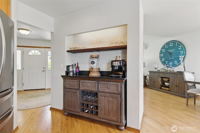 37401 Olympic View Rd NE, Hansville, WA 98340 - indoor dry bar featuring freestanding refrigerator and light wood-style floors