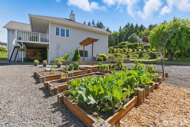 37401 Olympic View Rd NE, Hansville, WA 98340 - back of property featuring a garden, a chimney, and stairs