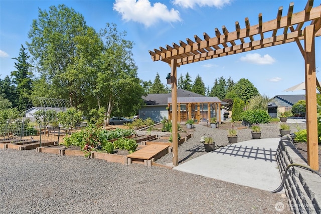 37401 Olympic View Rd NE, Hansville, WA 98340 - view of patio featuring a garden and a pergola