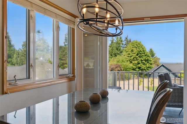 37401 Olympic View Rd NE, Hansville, WA 98340 - sunroom featuring a chandelier
