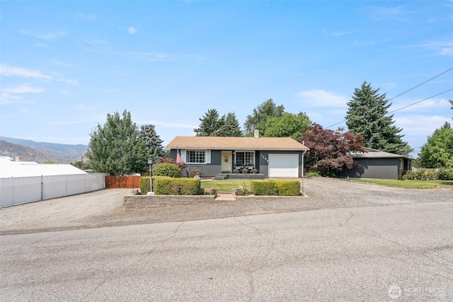1598 Tedford St SE, East Wenatchee, WA 98802 - ranch-style house with a garage, gravel driveway, and a chimney