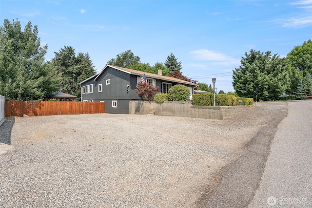 1598 Tedford St SE, East Wenatchee, WA 98802 - view of front facade with driveway and a chimney
