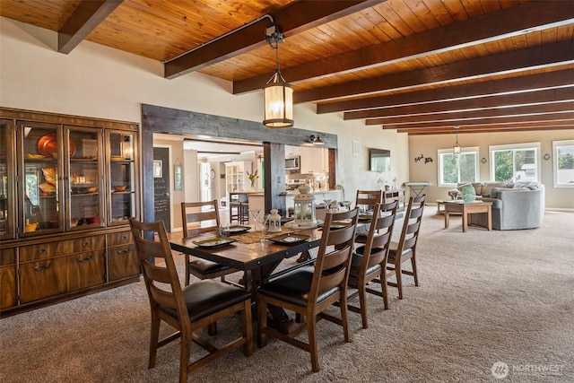 1598 Tedford St SE, East Wenatchee, WA 98802 - dining space with carpet floors and a wood ceiling with exposed beams