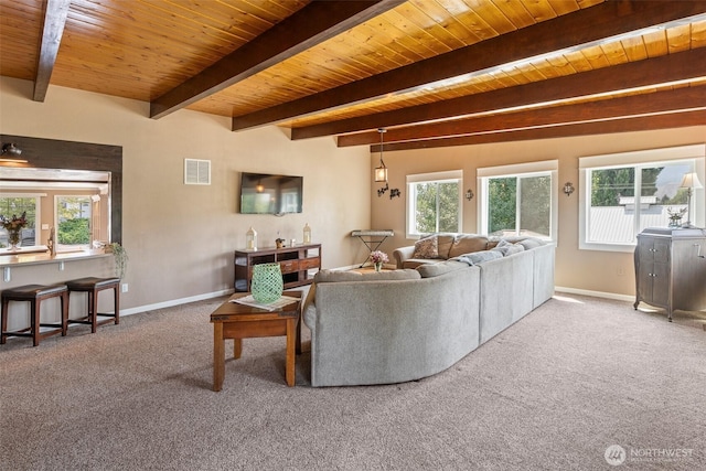 1598 Tedford St SE, East Wenatchee, WA 98802 - carpeted living room featuring a wooden ceiling with exposed beams and baseboards