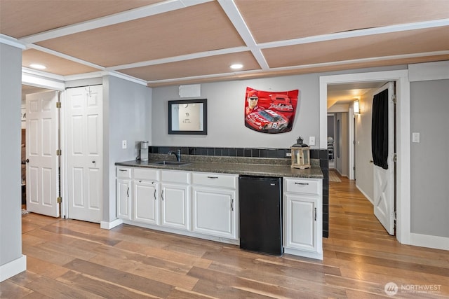 1598 Tedford St SE, East Wenatchee, WA 98802 - kitchen featuring dark countertops, recessed lighting, white cabinets, light wood-style flooring, and coffered ceiling