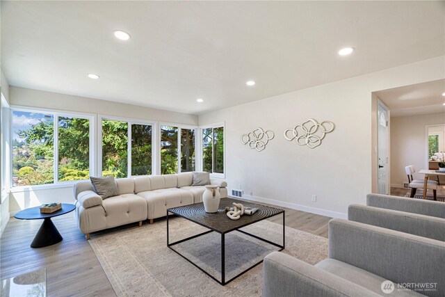 2874 30th Ave W, Seattle, WA 99819 - living room featuring healthy amount of natural light, recessed lighting, and light wood-style flooring