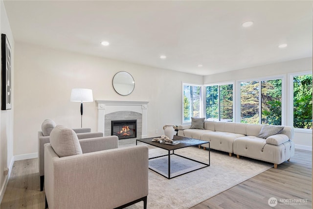 2874 30th Ave W, Seattle, WA 99819 - living area with light wood-style floors, recessed lighting, and a glass covered fireplace