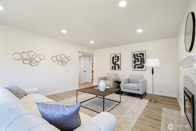 2874 30th Ave W, Seattle, WA 99819 - living room featuring light wood-style floors, a fireplace, and recessed lighting