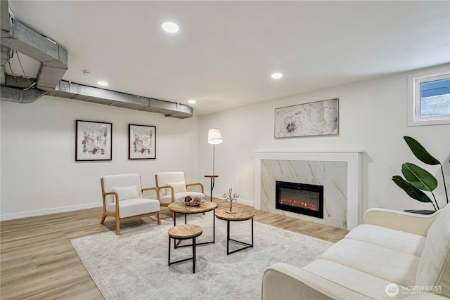 2874 30th Ave W, Seattle, WA 99819 - living room with wood finished floors, recessed lighting, and a premium fireplace