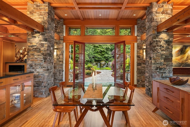 15910 Uplands Way SE, North Bend, WA 98045 - dining space featuring wood ceiling with exposed beams and light wood-style flooring