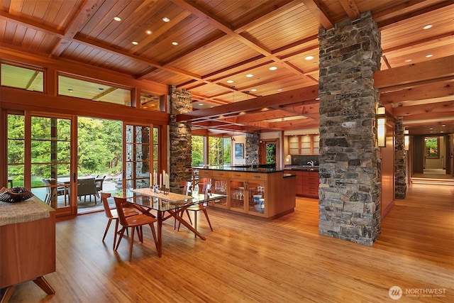15910 Uplands Way SE, North Bend, WA 98045 - dining space with ornate columns, wood ceiling with exposed beams, light wood-type flooring, recessed lighting, and coffered ceiling