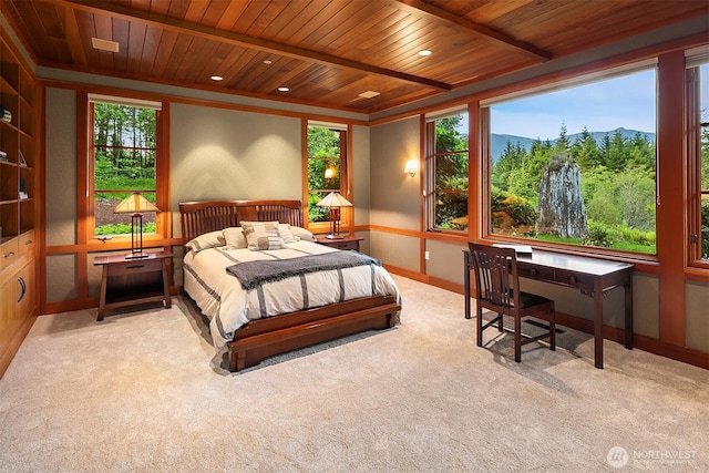 15910 Uplands Way SE, North Bend, WA 98045 - carpeted bedroom with wood ceiling with exposed beams, baseboards, a mountain view, and a desk