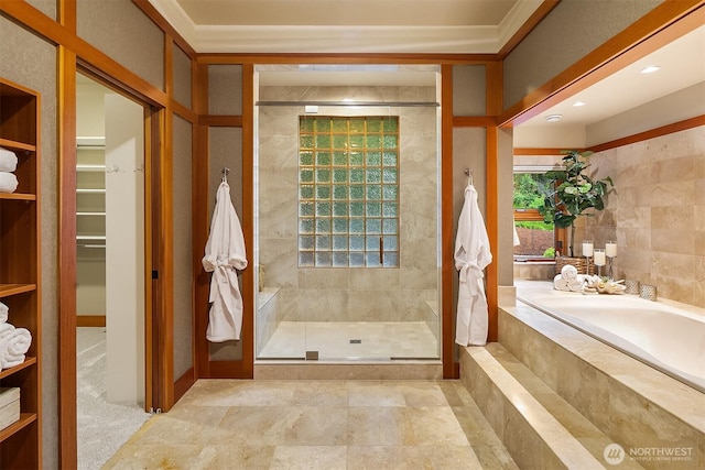 15910 Uplands Way SE, North Bend, WA 98045 - bathroom featuring a bath, a shower stall, a spacious closet, and crown molding