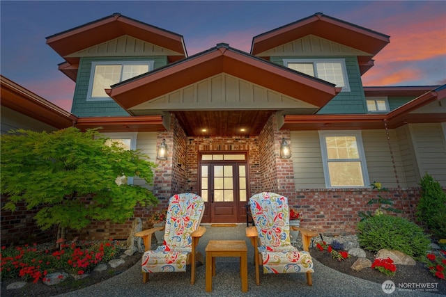 127 Bella Ln, Manson, WA 98831 - exterior entry at dusk featuring brick siding