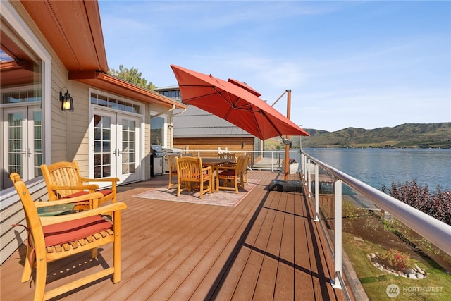127 Bella Ln, Manson, WA 98831 - wooden deck with french doors, a water and mountain view, and outdoor dining space