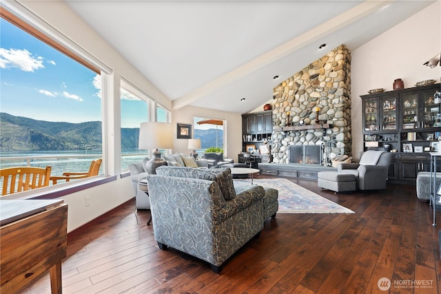 127 Bella Ln, Manson, WA 98831 - living area featuring hardwood / wood-style flooring, a stone fireplace, and a water and mountain view