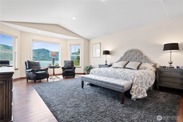 127 Bella Ln, Manson, WA 98831 - bedroom featuring dark wood-type flooring, vaulted ceiling, baseboards, and a mountain view
