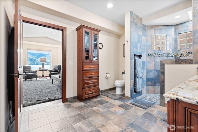 127 Bella Ln, Manson, WA 98831 - full bathroom featuring toilet, a walk in shower, vanity, baseboards, and recessed lighting