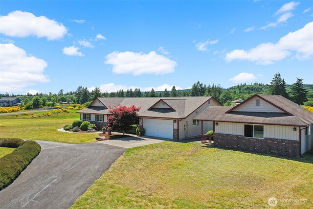 13820 Logez Ct SW, Olympia, WA 98512 - ranch-style home with an attached garage, asphalt driveway, brick siding, a front yard, and a shingled roof