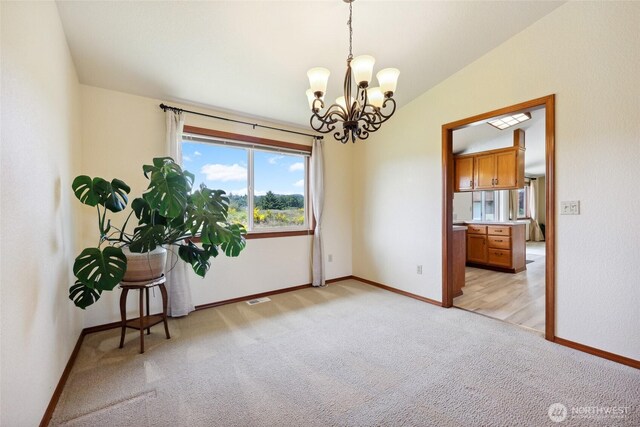 13820 Logez Ct SW, Olympia, WA 98512 - spare room featuring light carpet, a chandelier, baseboards, and vaulted ceiling
