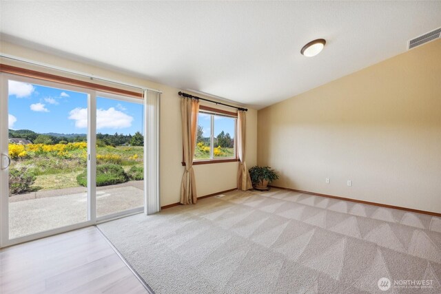 13820 Logez Ct SW, Olympia, WA 98512 - spare room with baseboards, light colored carpet, and vaulted ceiling