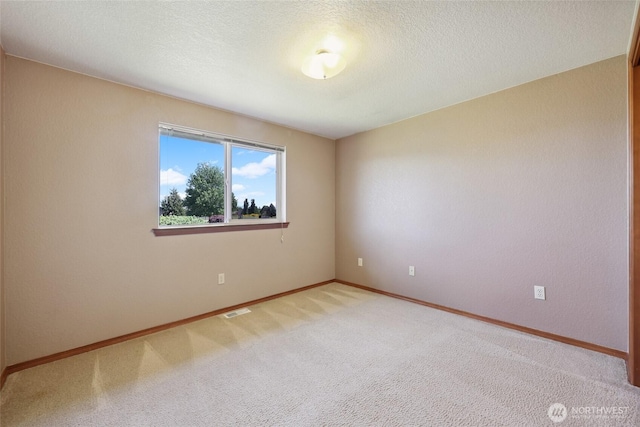 13820 Logez Ct SW, Olympia, WA 98512 - carpeted spare room with baseboards and a textured ceiling