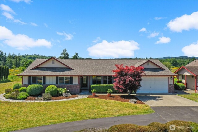 13820 Logez Ct SW, Olympia, WA 98512 - ranch-style home with brick siding, a garage, driveway, and a front lawn