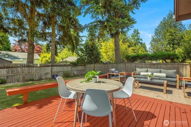 14331 Wallingford Ave N, Seattle, WA 98133 - wooden deck featuring an outdoor hangout area, a fenced backyard, and outdoor dining space